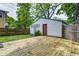 Backyard featuring a wooden deck, privacy fence, and a detached garage at 4244 Rookwood Ave, Indianapolis, IN 46208