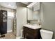 Well-lit bathroom features modern vanity and classic fixtures, offering a blend of style and function at 4244 Rookwood Ave, Indianapolis, IN 46208