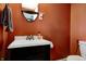Cozy powder room featuring a modern vanity and classic design elements, perfect for guests at 4244 Rookwood Ave, Indianapolis, IN 46208