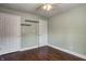 Simple bedroom featuring hardwood flooring, a ceiling fan, and two closets at 4244 Rookwood Ave, Indianapolis, IN 46208