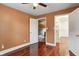 Bedroom with open closet, hardwood floors, and neutral paint at 4244 Rookwood Ave, Indianapolis, IN 46208