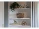Built-in bookshelves with decorative items like a bicycle, elephant, and plants at 4244 Rookwood Ave, Indianapolis, IN 46208