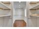 Spacious walk-in closet with custom shelving and ample storage at 4244 Rookwood Ave, Indianapolis, IN 46208