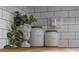 Close up of countertop features tile backsplash with plant and canisters at 4244 Rookwood Ave, Indianapolis, IN 46208