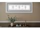 Decorative window with olive branches and candles on the console table at 4244 Rookwood Ave, Indianapolis, IN 46208