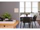 Bright dining room features modern table with seating and a window seat that provides natural light at 4244 Rookwood Ave, Indianapolis, IN 46208