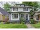 Charming two-story home with a landscaped front yard and welcoming entrance at 4244 Rookwood Ave, Indianapolis, IN 46208