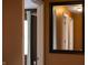 Hallway with neutral wall color and framed mirror reflecting another hallway at 4244 Rookwood Ave, Indianapolis, IN 46208