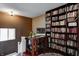 Inviting home office boasts custom bookshelf and hardwood flooring at 4244 Rookwood Ave, Indianapolis, IN 46208