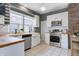 Bright, renovated kitchen with white cabinetry, stainless steel appliances, and butcher block countertops at 4244 Rookwood Ave, Indianapolis, IN 46208