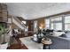 Bright living room featuring comfortable seating and a staircase at 4244 Rookwood Ave, Indianapolis, IN 46208