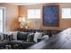 Comfortable gray sectional sofa in a stylish living room with ample natural light at 4244 Rookwood Ave, Indianapolis, IN 46208