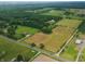 Appreciate the expansive land with surrounding greenery and the lake, captured in this aerial perspective at 4363 E State Road 252, Franklin, IN 46131