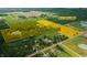 Aerial view of 55+/- total acres, featuring a private pond, lush farmland, and a peaceful wooded area at 4363 E State Road 252, Franklin, IN 46131