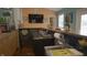 Home bar area with island, sink, television, and ample storage, creating a perfect space for entertaining guests at 4363 E State Road 252, Franklin, IN 46131