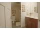 Bathroom featuring a cherry vanity with modern fixtures, plus tiled floor and bath at 4363 E State Road 252, Franklin, IN 46131