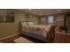 Comfortable bedroom with natural light, art, and bed with beach themed linen at 4363 E State Road 252, Franklin, IN 46131