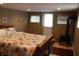 Charming bedroom with wood-burning stove, bed with beach themed linen, and backyard access at 4363 E State Road 252, Franklin, IN 46131