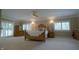 Spacious bedroom showcasing a large bed with a ceiling fan, natural light and beautiful furniture at 4363 E State Road 252, Franklin, IN 46131