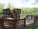 A multi-tiered wooden deck perfect for entertaining and relaxing by the serene pond at 4363 E State Road 252, Franklin, IN 46131