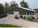 Large barn-style home with a spacious garage and a well-manicured lawn, ideal for rural living and hobbies at 4363 E State Road 252, Franklin, IN 46131