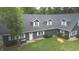 Elegant gray home featuring dormer windows, lush landscaping, and a manicured lawn at 4363 E State Road 252, Franklin, IN 46131