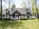 Attractive two-story home with a white porch and well-manicured lawn at 4363 E State Road 252, Franklin, IN 46131