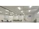 Large garage featuring vehicle, projector, screen, lounge furniture, and ample room at 4363 E State Road 252, Franklin, IN 46131
