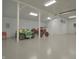 Spacious garage with a high ceiling, equipment, and ample storage space, suitable for multiple vehicles or hobbies at 4363 E State Road 252, Franklin, IN 46131