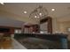 Kitchen island with dark granite countertop and stainless steel appliances at 4363 E State Road 252, Franklin, IN 46131