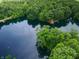 Experience serene beauty from an aerial view of the lake, with lush greenery surrounding the property at 4363 E State Road 252, Franklin, IN 46131
