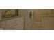 Well-lit laundry room boasts granite countertops, stainless steel hardware, and a side-by-side washer and dryer at 4363 E State Road 252, Franklin, IN 46131