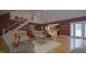 An open-concept living room boasts vaulted ceilings, hardwood floors, and seamless transition into the gourmet kitchen at 4363 E State Road 252, Franklin, IN 46131