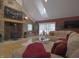 Inviting living room featuring a stone fireplace, hardwood floors, and comfortable seating at 4363 E State Road 252, Franklin, IN 46131
