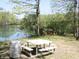 Picnic table set with trash can by the lake offers beautiful view for dining or enjoying the scenery at 4363 E State Road 252, Franklin, IN 46131