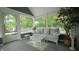 Cozy screened-in porch with comfortable seating, a decorative rug, and views of the tranquil outdoors at 4363 E State Road 252, Franklin, IN 46131