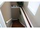 Stairway descends with white railing, natural light and brown steps at 4363 E State Road 252, Franklin, IN 46131