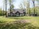 Spacious yard featuring a well-maintained lawn and mature trees surrounding the house at 4363 E State Road 252, Franklin, IN 46131