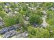 Wide-angle aerial view of homes with mature trees and community pool and park at 440 W Marion St, Danville, IN 46122