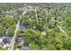 Aerial photograph of a quaint town features mature trees and well kept properties at 440 W Marion St, Danville, IN 46122