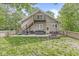 Backyard with a deck, grill, hot tub, firepit, second story deck, and well-manicured lawn at 440 W Marion St, Danville, IN 46122