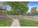 Fenced backyard with lush green grass and a charming picket fence at 440 W Marion St, Danville, IN 46122