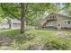 Expansive backyard featuring a deck with a hot tub and grill, complemented by lush landscaping at 440 W Marion St, Danville, IN 46122