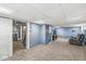 Finished basement providing ample space for a recreational area, complete with exercise equipment at 440 W Marion St, Danville, IN 46122