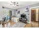 Well-lit bedroom with hardwood floors, complemented by a ceiling fan and decorative elements at 440 W Marion St, Danville, IN 46122