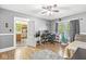 Versatile room featuring both bedroom and office setups, wood flooring, and ample natural light at 440 W Marion St, Danville, IN 46122