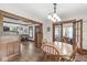 Open dining room with hardwood floors and abundant natural light at 440 W Marion St, Danville, IN 46122