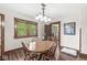 Charming dining room featuring a wood table set with a window view and dark-stained wood trim at 440 W Marion St, Danville, IN 46122