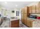 Well-lit kitchen with stainless steel appliances and granite countertops at 440 W Marion St, Danville, IN 46122