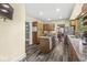 Well-lit kitchen featuring stainless steel appliances, granite countertops, and an island at 440 W Marion St, Danville, IN 46122